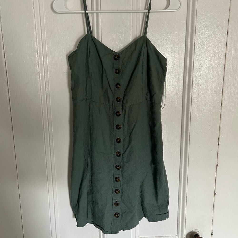 Green button up dress.